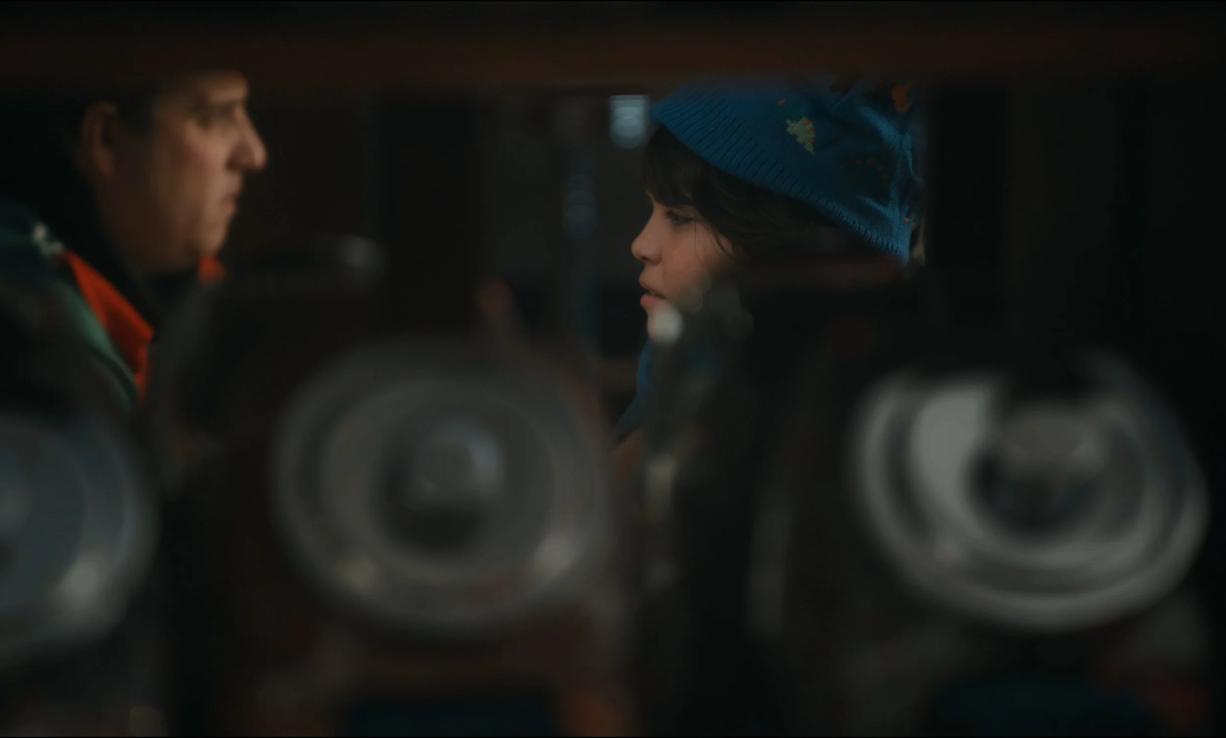 Toby speaking with an adult through reflected glass